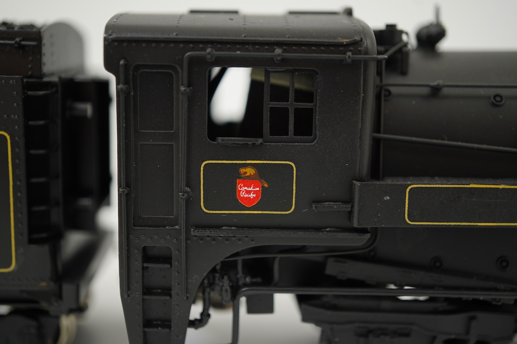 Two boxed HO gauge Canadian Pacific locomotives; a Toby of Japan model of 2412, 4-6-2 locomotive with bogie tender, together with a United Scale Models 3710, 2-8-0 locomotive with bogie tender, both powered for two rail